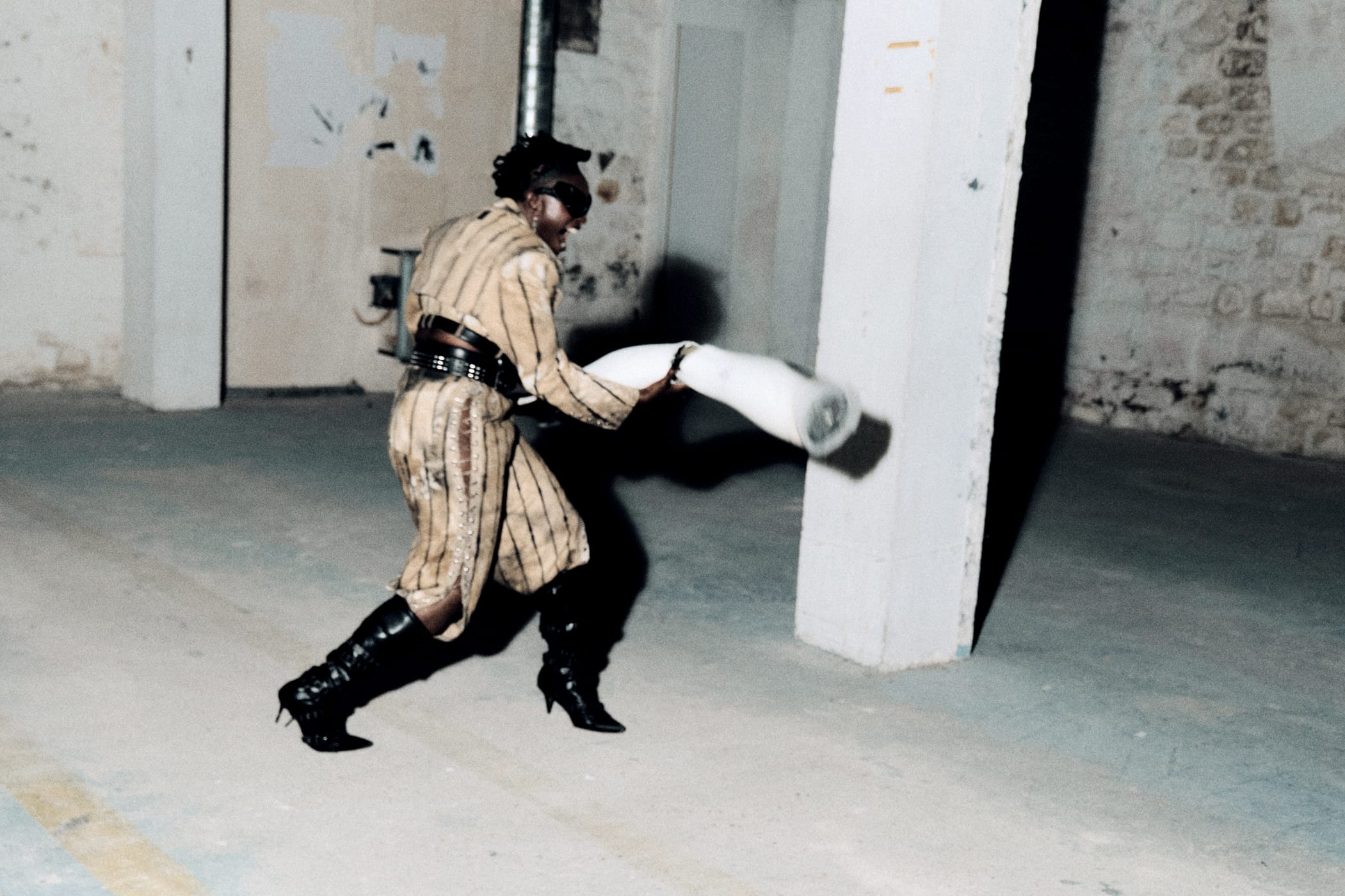 Ezek running with the length of white pipe, coat swinging