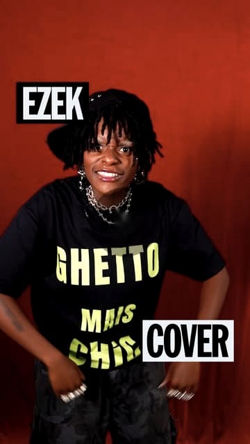 Konbini card: Ezek smiling in a Ghetto mais chic tee on a red ground