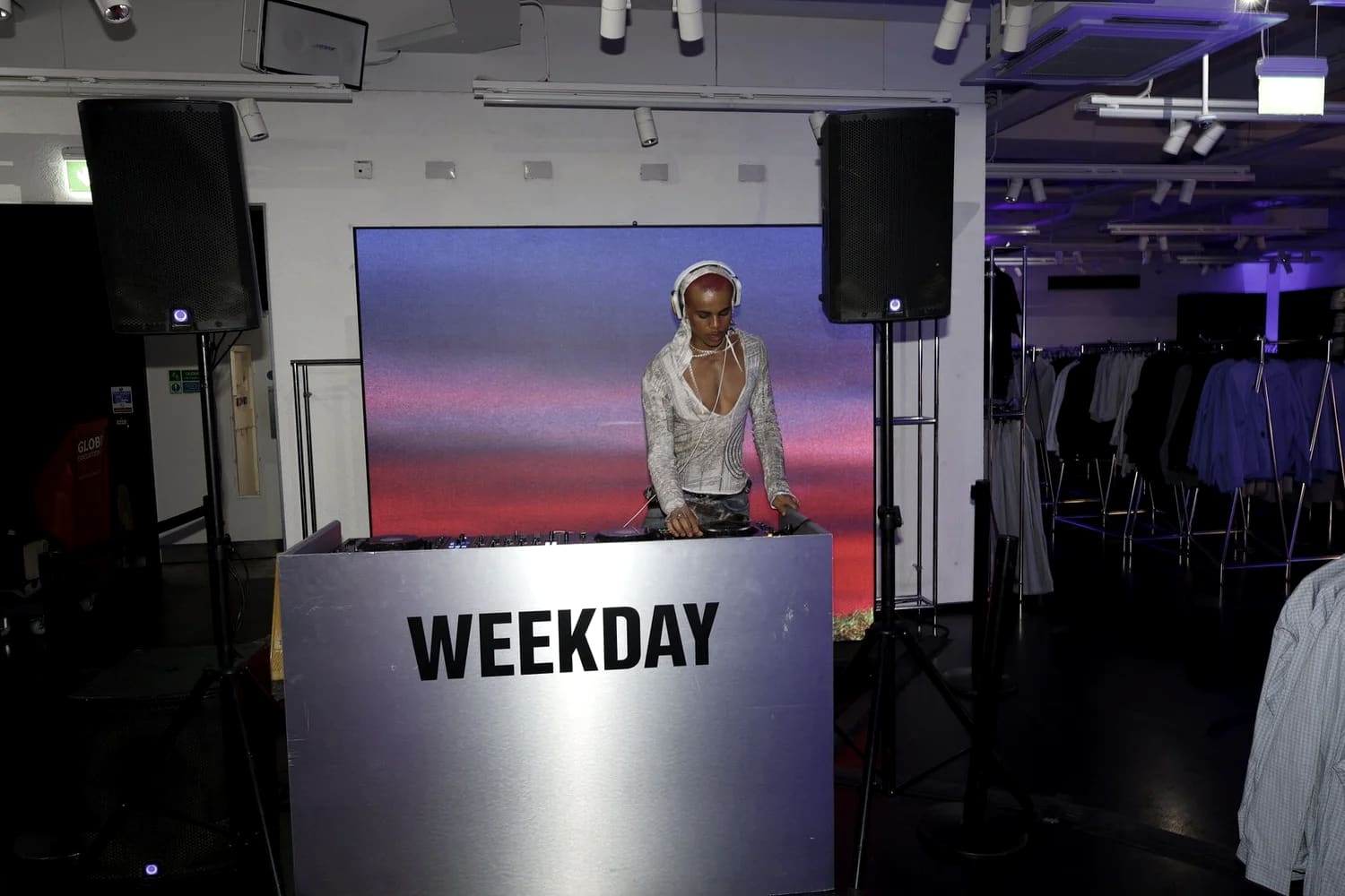 Oluwa at the decks behind the Weekday sign, in-store