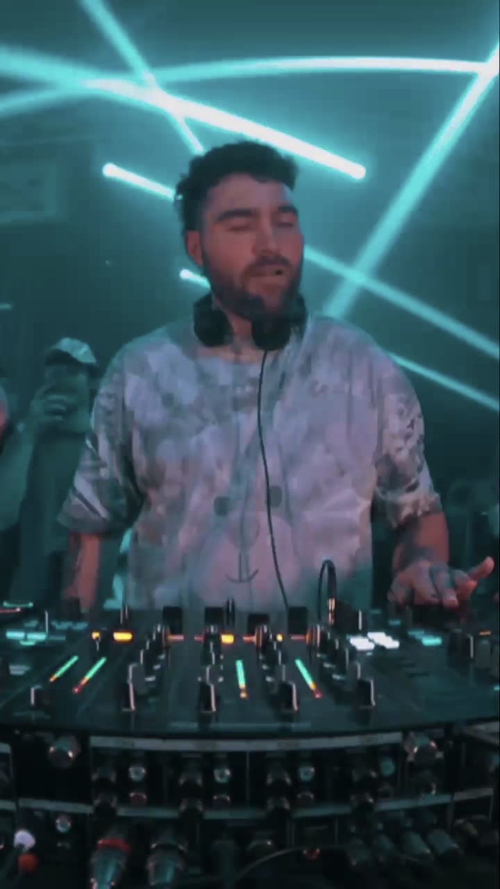 TWONSKi lit at the decks at SILO, white lasers behind